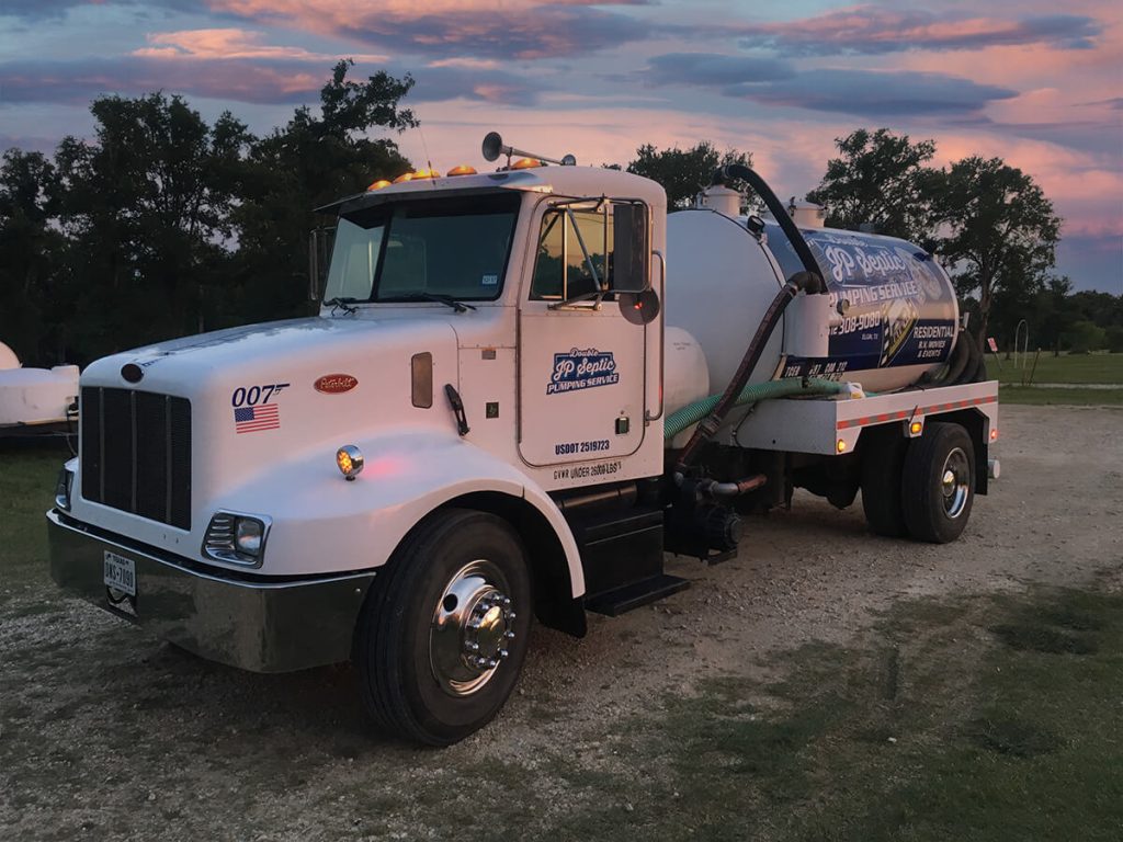 Septic Tank Pumping Truck in the evening